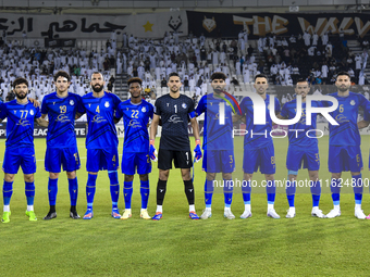 Esteghlal FC players line up before the AFC Champions League elite west football match between Qatar's Al Sadd SC and Iran's Esteghlal FC at...