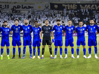 Esteghlal FC players line up before the AFC Champions League elite west football match between Qatar's Al Sadd SC and Iran's Esteghlal FC at...