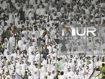 Fans of Al Sadd SC cheer for their team during the AFC Champions League elite west football match between Qatar's Al Sadd SC and Iran's Este...