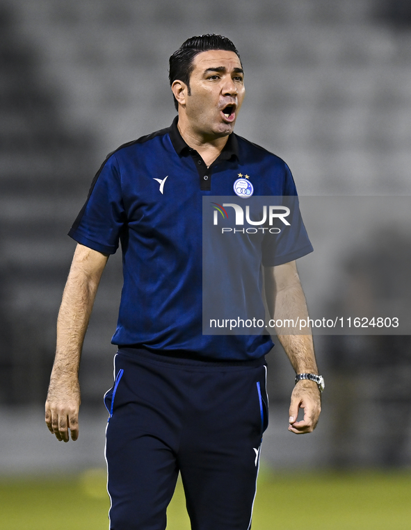 Esteghlal FC Head Coach, Javad Nekounam, reacts during the AFC Champions League elite west football match between Qatar's Al Sadd SC and Ira...