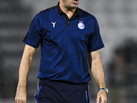 Esteghlal FC Head Coach, Javad Nekounam, reacts during the AFC Champions League elite west football match between Qatar's Al Sadd SC and Ira...