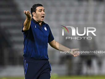 Esteghlal FC Head Coach, Javad Nekounam, reacts during the AFC Champions League elite west football match between Qatar's Al Sadd SC and Ira...