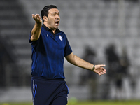 Esteghlal FC Head Coach, Javad Nekounam, reacts during the AFC Champions League elite west football match between Qatar's Al Sadd SC and Ira...