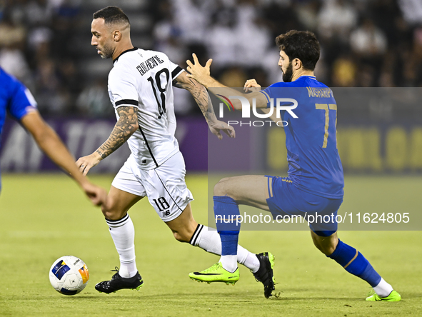 Guilherme Torres (L) of Al Sadd SC battles for the ball with Jaloliddin Masharipov of Esteghlal FC during the AFC Champions League elite wes...