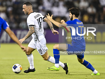 Guilherme Torres (L) of Al Sadd SC battles for the ball with Jaloliddin Masharipov of Esteghlal FC during the AFC Champions League elite wes...