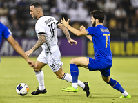 Guilherme Torres (L) of Al Sadd SC battles for the ball with Jaloliddin Masharipov of Esteghlal FC during the AFC Champions League elite wes...