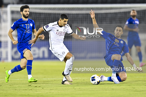 Youcef Atal of Al Sadd SC battles for the ball with Arash Rezavand of Esteghlal FC during the AFC Champions League elite west football match...