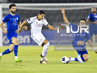 Youcef Atal of Al Sadd SC battles for the ball with Arash Rezavand of Esteghlal FC during the AFC Champions League elite west football match...