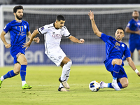 Youcef Atal of Al Sadd SC battles for the ball with Arash Rezavand of Esteghlal FC during the AFC Champions League elite west football match...