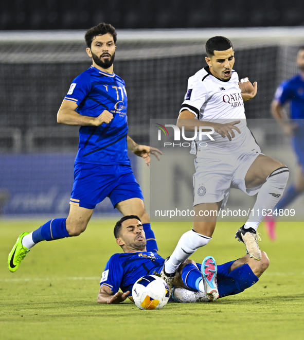 Youcef Atal (R) of Al Sadd SC battles for the ball with Arash Rezavand of Esteghlal FC during the AFC Champions League elite west football m...