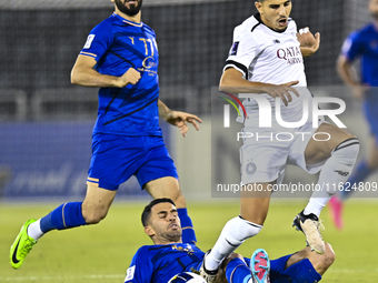 Youcef Atal (R) of Al Sadd SC battles for the ball with Arash Rezavand of Esteghlal FC during the AFC Champions League elite west football m...