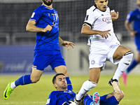 Youcef Atal (R) of Al Sadd SC battles for the ball with Arash Rezavand of Esteghlal FC during the AFC Champions League elite west football m...