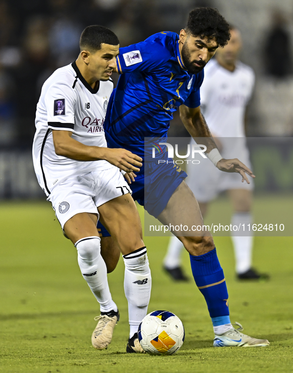 Youcef Atal of Al Sadd SC battles for the ball with Saman Fallah of Esteghlal FC during the AFC Champions League elite west football match b...