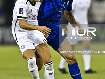 Youcef Atal of Al Sadd SC battles for the ball with Saman Fallah of Esteghlal FC during the AFC Champions League elite west football match b...