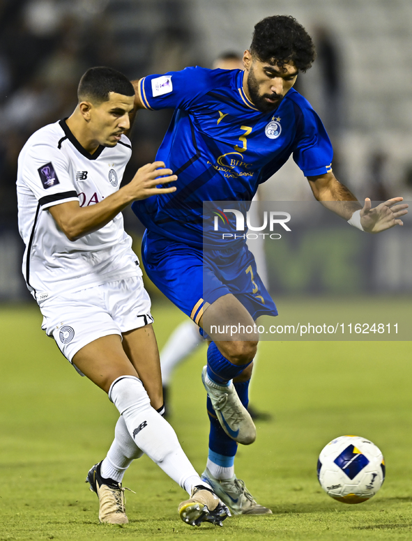 Youcef Atal of Al Sadd SC battles for the ball with Saman Fallah of Esteghlal FC during the AFC Champions League elite west football match b...