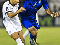 Youcef Atal of Al Sadd SC battles for the ball with Saman Fallah of Esteghlal FC during the AFC Champions League elite west football match b...