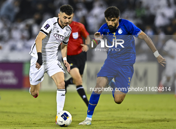 Rafael Sebastian Mujica Garcia of Al Sadd SC battles for the ball with Saman Fallah of Esteghlal FC during the AFC Champions League elite we...