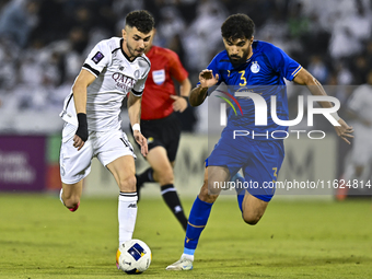 Rafael Sebastian Mujica Garcia of Al Sadd SC battles for the ball with Saman Fallah of Esteghlal FC during the AFC Champions League elite we...