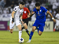 Rafael Sebastian Mujica Garcia of Al Sadd SC battles for the ball with Saman Fallah of Esteghlal FC during the AFC Champions League elite we...