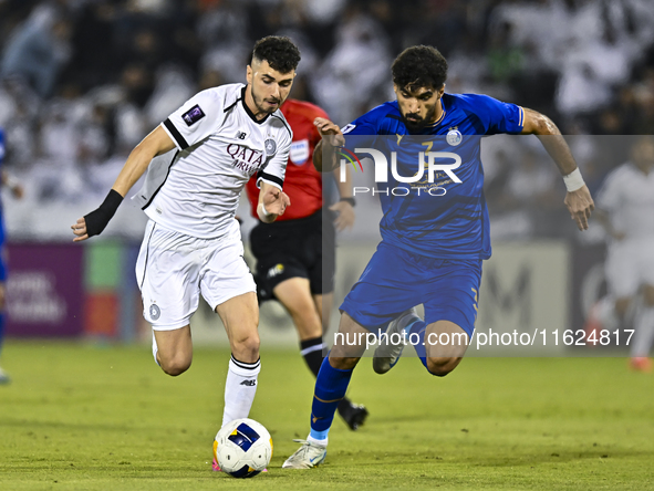 Rafael Sebastian Mujica Garcia of Al Sadd SC battles for the ball with Saman Fallah of Esteghlal FC during the AFC Champions League elite we...