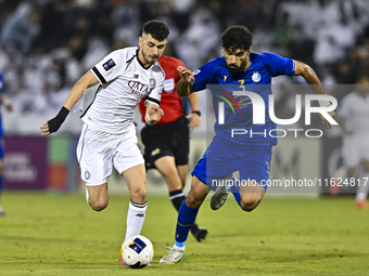 Rafael Sebastian Mujica Garcia of Al Sadd SC battles for the ball with Saman Fallah of Esteghlal FC during the AFC Champions League elite we...