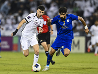 Rafael Sebastian Mujica Garcia of Al Sadd SC battles for the ball with Saman Fallah of Esteghlal FC during the AFC Champions League elite we...