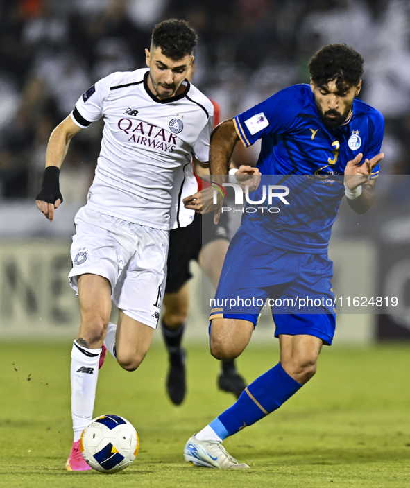 Rafael Sebastian Mujica Garcia of Al Sadd SC battles for the ball with Saman Fallah of Esteghlal FC during the AFC Champions League elite we...