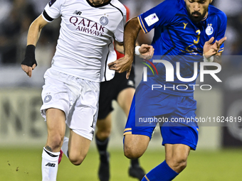 Rafael Sebastian Mujica Garcia of Al Sadd SC battles for the ball with Saman Fallah of Esteghlal FC during the AFC Champions League elite we...