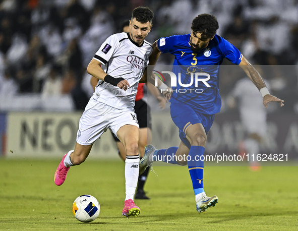 Rafael Sebastian Mujica Garcia of Al Sadd SC battles for the ball with Saman Fallah of Esteghlal FC during the AFC Champions League elite we...