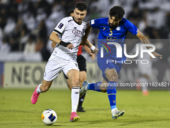 Rafael Sebastian Mujica Garcia of Al Sadd SC battles for the ball with Saman Fallah of Esteghlal FC during the AFC Champions League elite we...