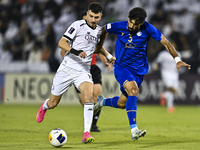 Rafael Sebastian Mujica Garcia of Al Sadd SC battles for the ball with Saman Fallah of Esteghlal FC during the AFC Champions League elite we...