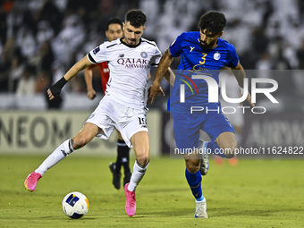 Rafael Sebastian Mujica Garcia of Al Sadd SC battles for the ball with Saman Fallah of Esteghlal FC during the AFC Champions League elite we...