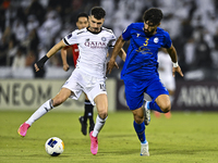 Rafael Sebastian Mujica Garcia of Al Sadd SC battles for the ball with Saman Fallah of Esteghlal FC during the AFC Champions League elite we...