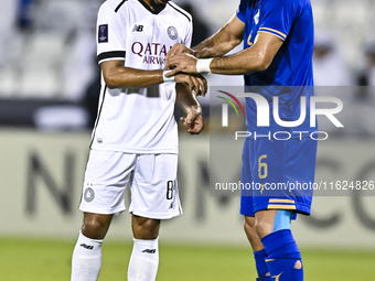 Akram Hassan Afif of Al Sadd SC and Iman Salimi of Esteghlal FC react during the AFC Champions League elite west football match between Qata...