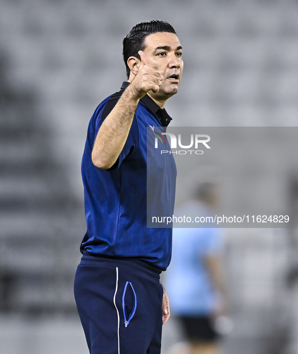 Esteghlal FC Head Coach, Javad Nekounam, reacts during the AFC Champions League elite west football match between Qatar's Al Sadd SC and Ira...