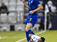 Pedro Miguel Correia (bottom) of Al Sadd SC battles for the ball with Gustavo Blanco of Esteghlal FC during the AFC Champions League elite w...