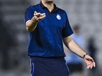 Esteghlal FC Head Coach, Javad Nekounam, reacts during the AFC Champions League elite west football match between Qatar's Al Sadd SC and Ira...