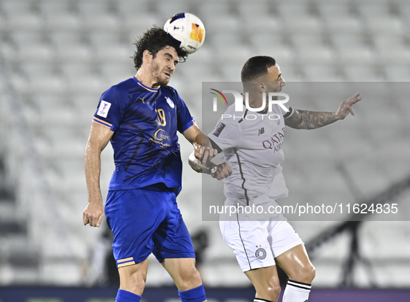 Guilherme Torres of Al Sadd SC battles for the ball with Gustavo Blanco of Esteghlal FC during the AFC Champions League elite west football...