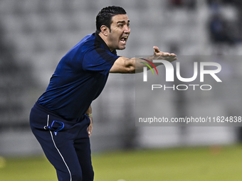 Esteghlal FC Head Coach, Javad Nekounam, reacts during the AFC Champions League elite west football match between Qatar's Al Sadd SC and Ira...