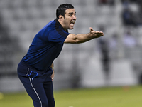 Esteghlal FC Head Coach, Javad Nekounam, reacts during the AFC Champions League elite west football match between Qatar's Al Sadd SC and Ira...