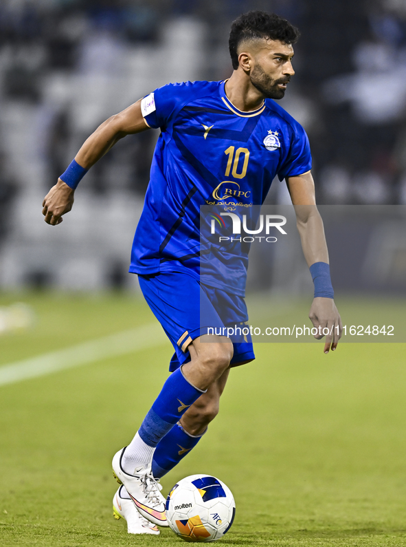 Ramin Rezaeian of Esteghlal FC plays during the AFC Champions League elite west football match between Qatar's Al Sadd SC and Iran's Esteghl...