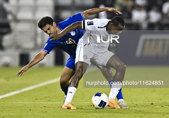 Mohamed Camara (R) of Al Sadd SC battles for the ball with Mohammadhossein Eslami of Esteghlal FC during the AFC Champions League elite west...