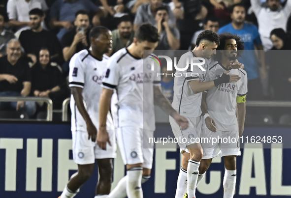 Akram Hassan Afif (R) of Al Sadd SC celebrates after scoring the second goal during the AFC Champions League elite west football match betwe...