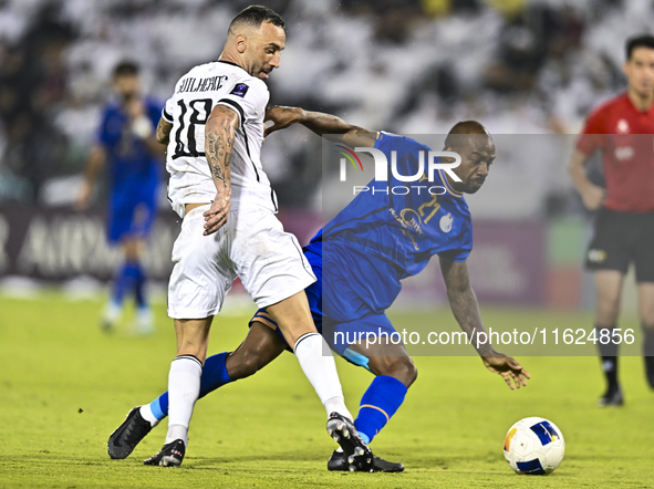 Guilherme Torres of Al Sadd SC battles for the ball with Gael Kakuta of Esteghlal FC during the AFC Champions League elite west football mat...