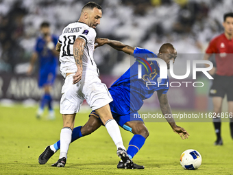 Guilherme Torres of Al Sadd SC battles for the ball with Gael Kakuta of Esteghlal FC during the AFC Champions League elite west football mat...