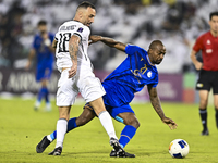 Guilherme Torres of Al Sadd SC battles for the ball with Gael Kakuta of Esteghlal FC during the AFC Champions League elite west football mat...