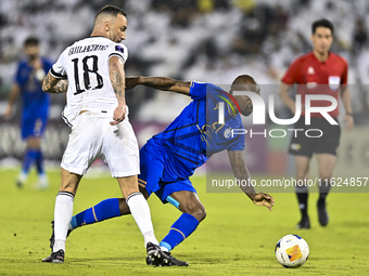 Guilherme Torres of Al Sadd SC battles for the ball with Gael Kakuta of Esteghlal FC during the AFC Champions League elite west football mat...