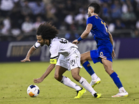 Akram Hassan Afif of Al Sadd SC battles for the ball with Ramin Rezaeian of Esteghlal FC during the AFC Champions League elite west football...