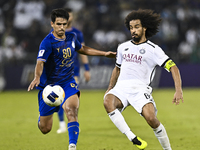 Akram Hassan Afif (R) of Al Sadd SC battles for the ball with Mohammadhossein Eslami of Esteghlal FC during the AFC Champions League elite w...