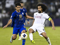 Akram Hassan Afif (R) of Al Sadd SC battles for the ball with Mohammadhossein Eslami of Esteghlal FC during the AFC Champions League elite w...